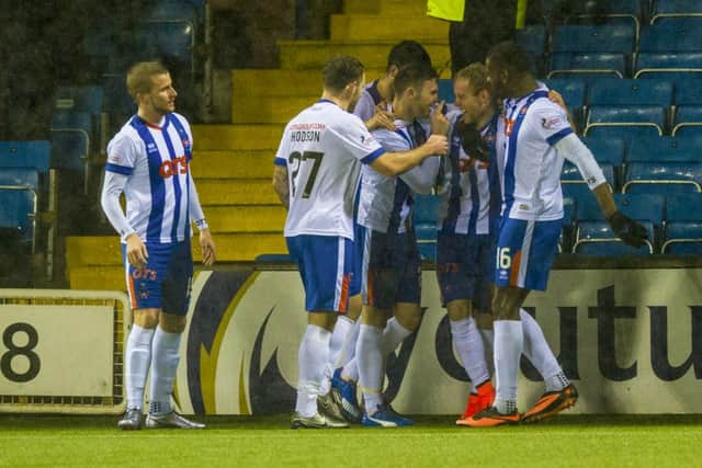 Kilmarnock's Rory McKenzie (centre) celebrates after making it 1-1. Picture: SNS