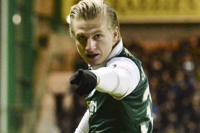 Hibs goal hero Jason Cummings celebrates his winning strike in last nights cup tie against Hearts. Picture: SNS