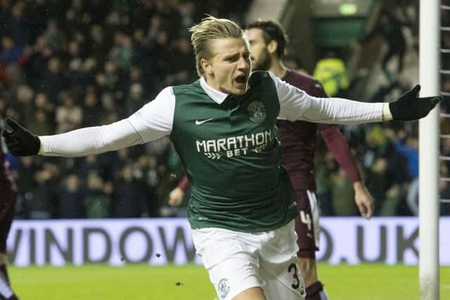 Jason Cummings celebrates having put him his side in front. Picture: SNS