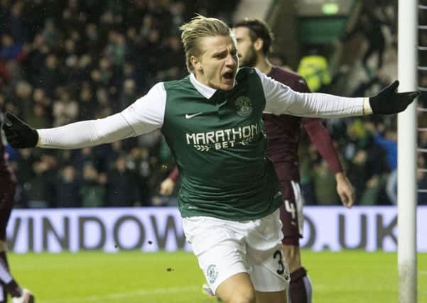 Jason Cummings celebrates having put him his side in front. Picture: SNS
