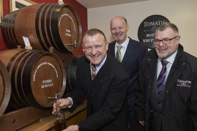 From left: Drew Hendry with distillery general manager Graham Eunson and Tomatin chief executive Robert Anderson