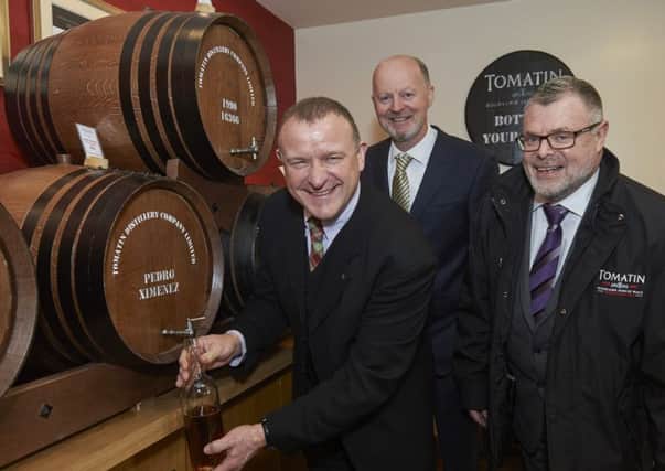 From left: Drew Hendry with distillery general manager Graham Eunson and Tomatin chief executive Robert Anderson