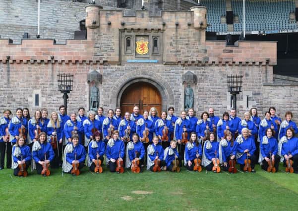 Shetland fiddlers in front of replica Edinburgh Castle in Melbourne