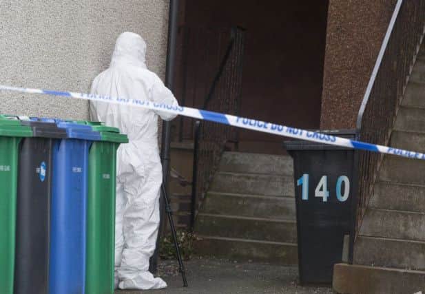 Forensic officer outside flats in Leven, Fife where a five-month-old baby is believed to have suffered serious life-threatening injuries. Picture: Hemedia