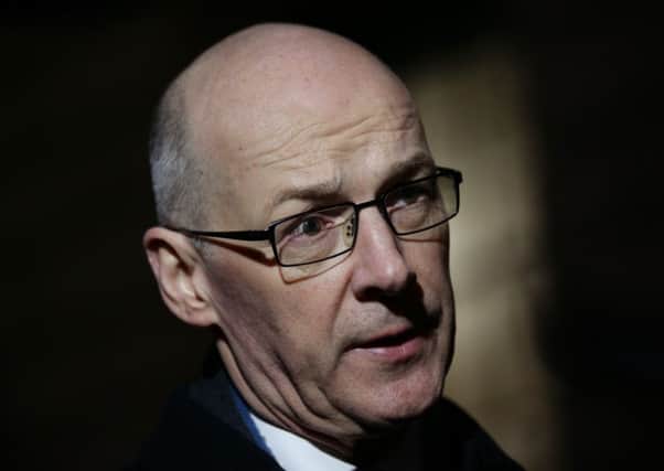 Robertson said John Swinney's continuation of the council tax freeze was 'handicapping' councils. Picture: PA