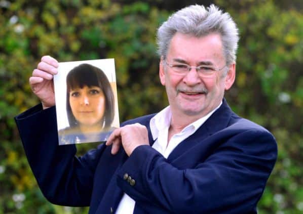 Michael Brown with a picture of his late daughter Clare