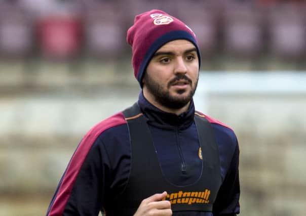 Hearts' Alim Ozturk is put through his paces at training. Picture: SNS