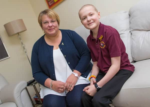 Toby Etheridge with mum Alison. Toby has sold 85 tickets to his charity ball, after support from the online community and sports presenter Gabby Logan. Image: Stephen Brown