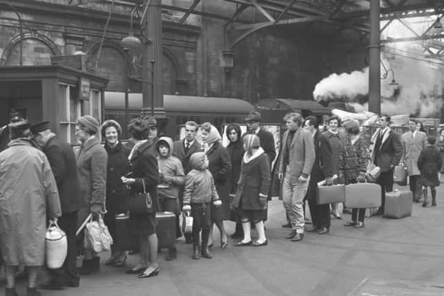 Passengers queue for a spring holiday special train at Waverley station in April 1966. Picture: TSPL