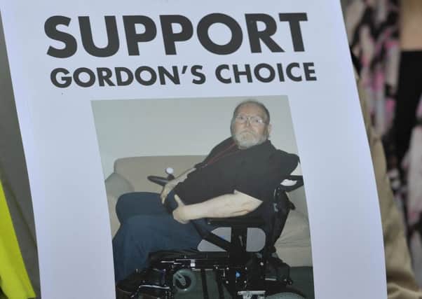 Supporters of 66 year-old disabled grandfather Gordon Ross  gathered in Edinburgh's Parliament Square in May 2015 as the Court of Session rejected his petition. Image: 
Ian Rutherford