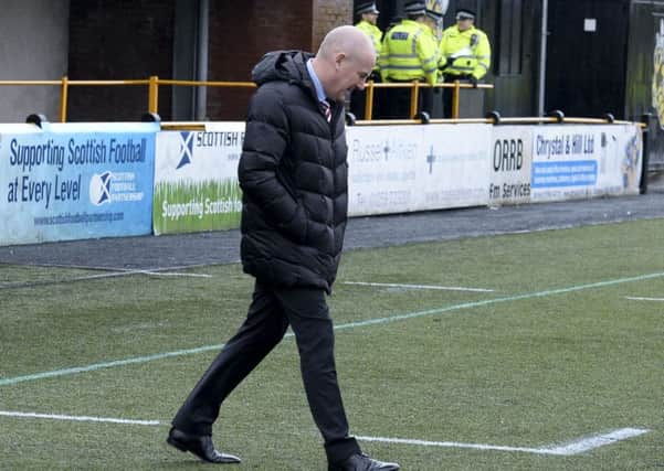 Mark Warburton inspects the turf prior to last weekend's draw with Alloa. Picture: SNS