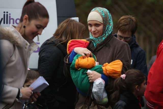 Syrian refugees arrive on the Isle of Bute in December. Picture: Getty