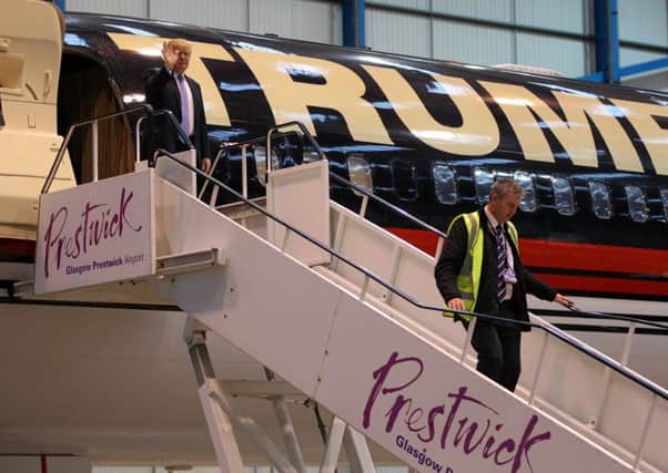 Trump arrives at Prestwick in 2014. Picture: SWNS/Hemedia