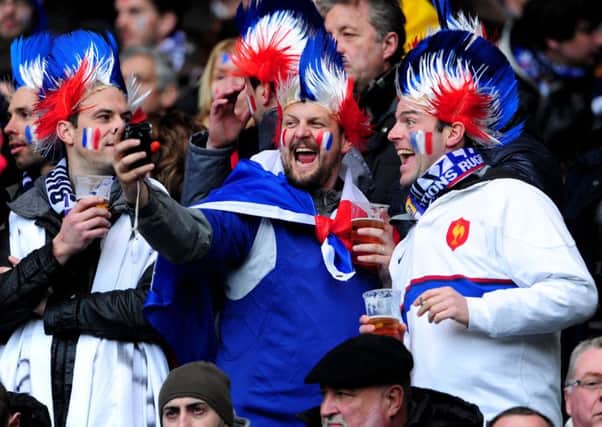 Thousands of French fans arrive at Edinburgh Airport for the biannual rugby match. Photograph: Ian Rutherford