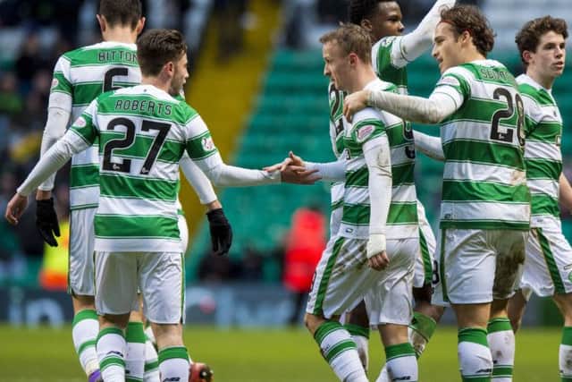 Celtic goalscorer Leigh Griffiths celebrates with debutant Patrick Roberts. Picture: SNS