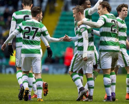Celtic goalscorer Leigh Griffiths celebrates with debutant Patrick Roberts. Picture: SNS