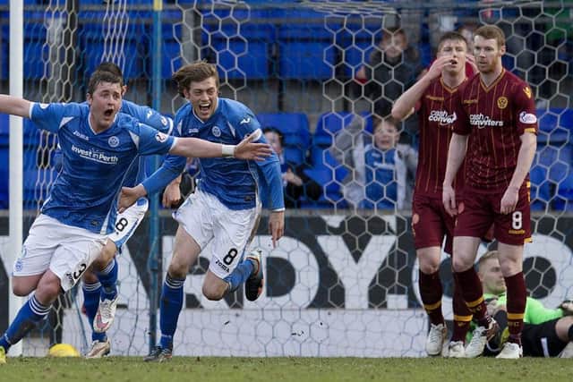 St Johnstone hero Tam Scobbie charges off to celebrate his late winner. Picture: SNS