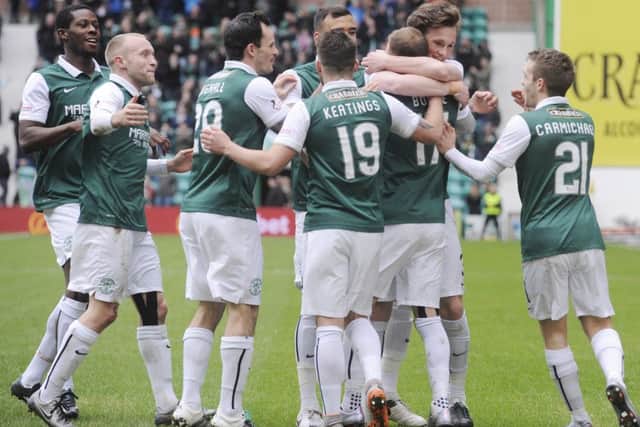 Martin Boyle celebrates along with his Hibs team-mates after netting the opener. Picture: Greg Macvean