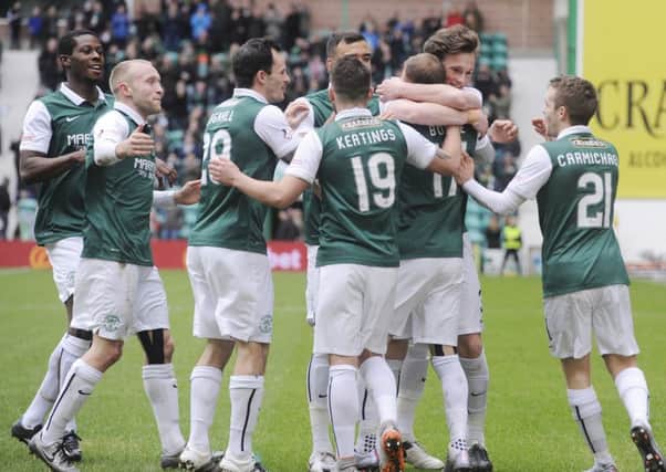Martin Boyle celebrates along with his Hibs team-mates after netting the opener. Picture: Greg Macvean