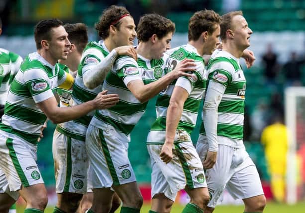 Celtic players rush to congratulate Leigh Griffiths. Picture: SNS