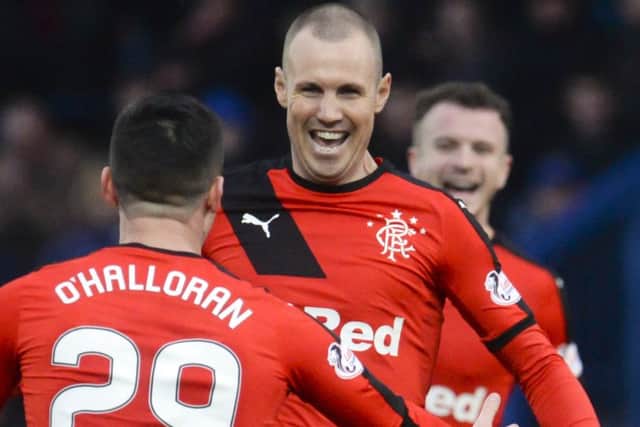 Kenny Miller celebrates after making it 1-0. Picture: SNS