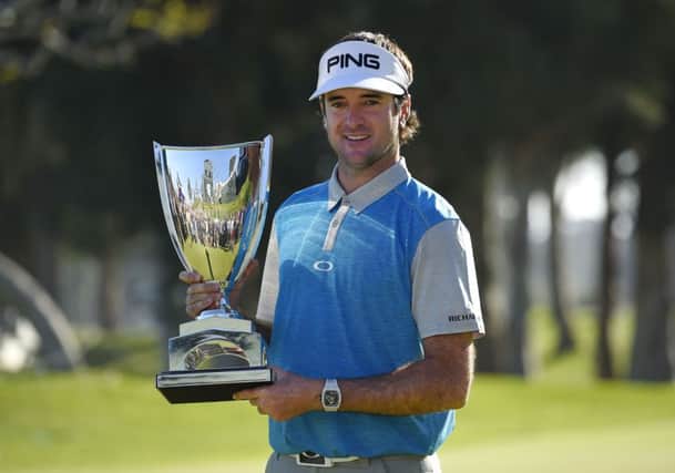 Bubba Watson holds his trophy after winning the Northern Trust Open golf tournament. Picture: AP