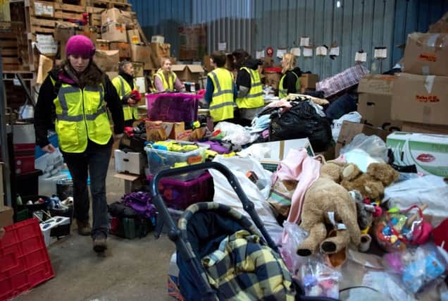 Volonteers sort food and clothes for migrants. Picture: AFP/Getty
