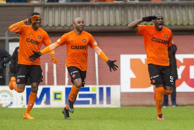 Guy Demel, right, limped off after scoring. Picture: SNS