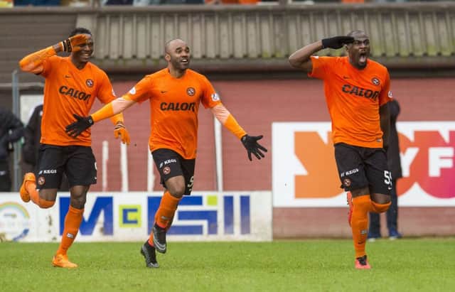 Guy Demel, right, limped off after scoring. Picture: SNS