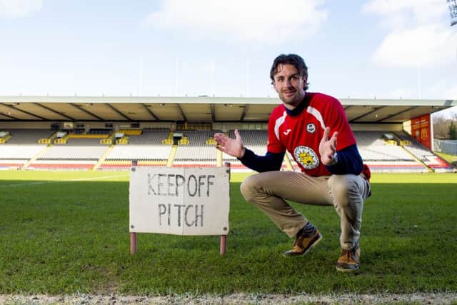 Partick Thistle defender Dan Seaborne beside the Firhill pitch, which has caused several call-offs for the Maryhill side this season. Picture: SNS