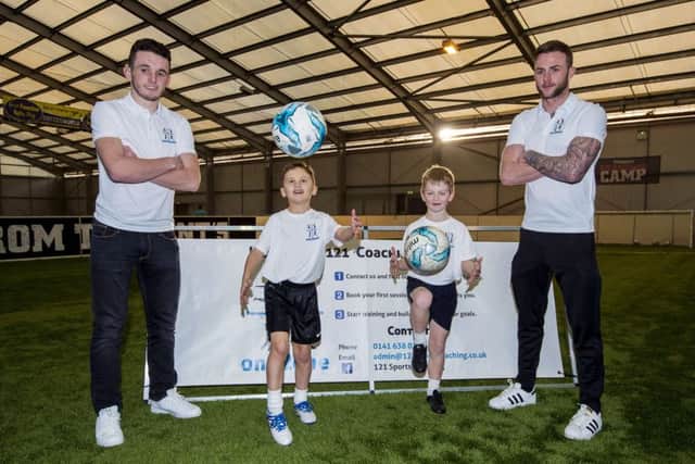 John McGinn, Thomas Greig, Kyle Robin and Partick Thistles Christie Elliot promote 121 coaching sessions. Picture: SNS
