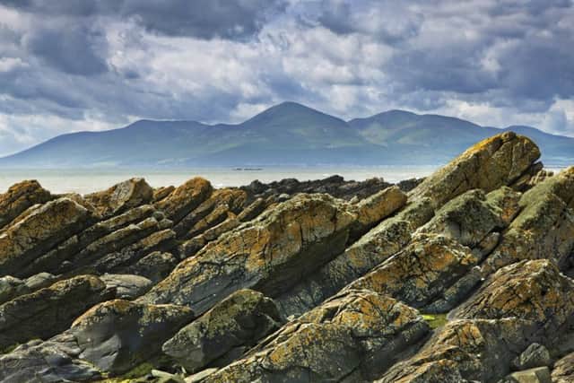 The Mourne Mountains from Rocky Shore Near Tyrella, Northern Ireland. Picture: PA