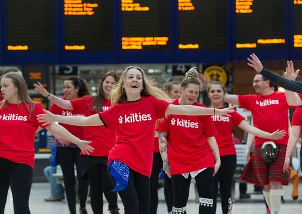 Volunteers helping out at the events (know as Kilties)  jump into life with a flashmob. 

Picture: John Devlin.
