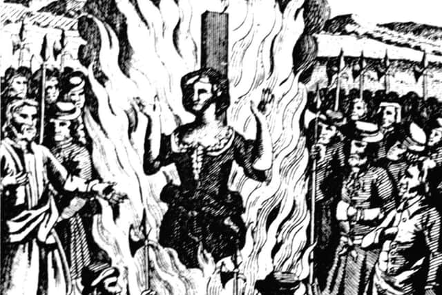 An etching of a witch burning