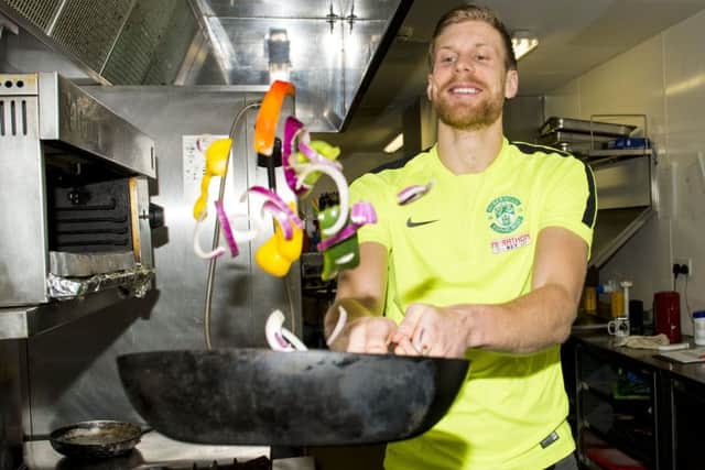 Niklas Gunnarsson puts his culinary skills to the test at Hibs East Mains training centre ahead of tonights game against Morton. Picture: SNS Group