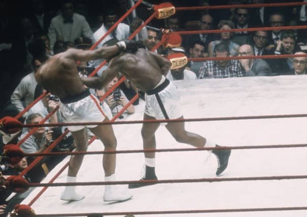 Cassius Clay won the world heavyweight boxing championship in 1964, when Sonny Liston retired in round seven. Picture: Getty Images