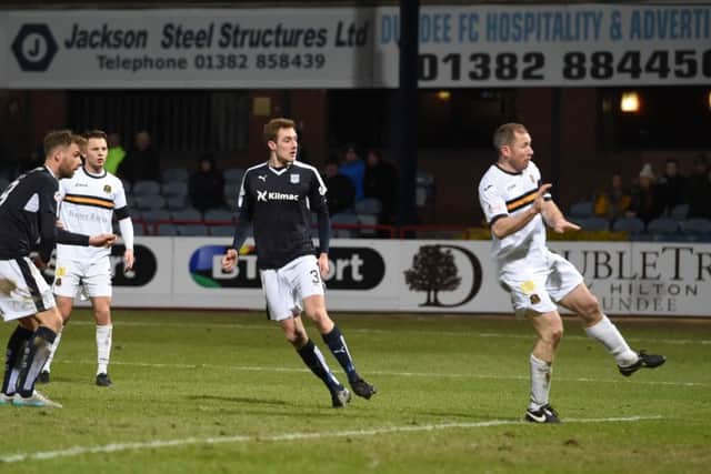 Dundee's Kevin Holt scores his side's fourth. Picture: SNS