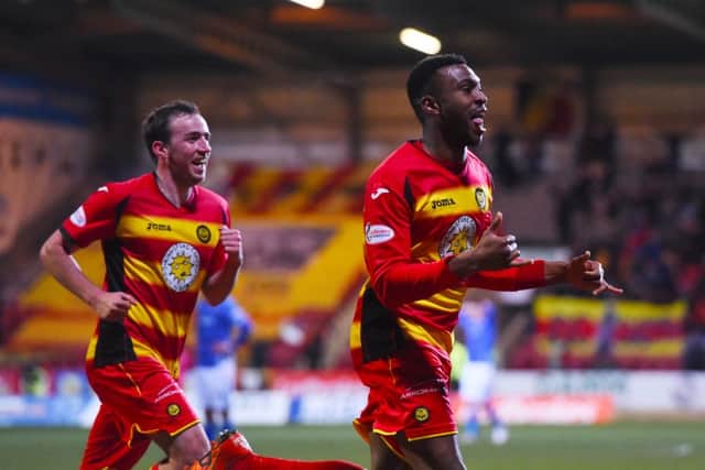 Partick's David Amoo (right) celebrates after he puts away his side's second goal. Picture: SNS