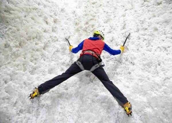 Climber tackles indoor ice wall