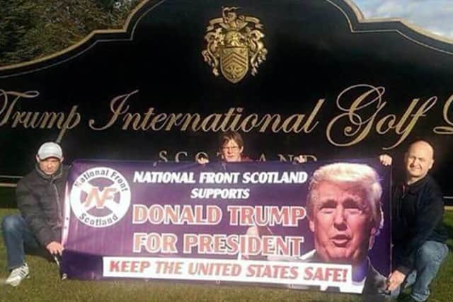 Members of the far-right group posed outside the Trump International Golf Links in Aberdeenshire with a banner stating they backed Trump for the White House