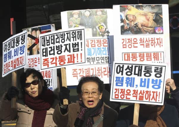 North Korean defectors denounce North Koreas criticism of South Korean President Park Geun-hye. Picture: AP