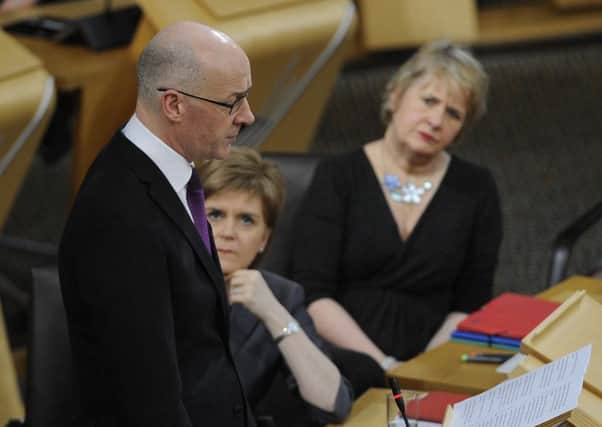 Opposition parties and trade unions are urging John Swinney to rethink council budget cuts. Picture: Neil Hanna