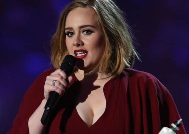 Adele with her British female solo artist award  she won four in total. Picture: AFP/Getty Images