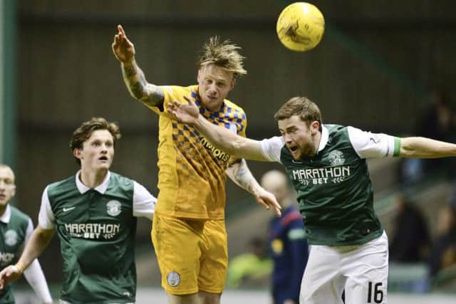 Hibernian's Lewis Stevenson (right) is challenged by Denny Johnstone. Picture: SNS Group