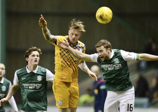Hibernian's Lewis Stevenson (right) is challenged by Denny Johnstone. Picture: SNS Group