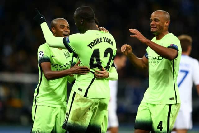 Fernandinho, Yaya Toure and Vincent Kompany celebrate after Manchester City claimed a comfortable 3-1 victory over Dynamo Kiev. Picture: Getty