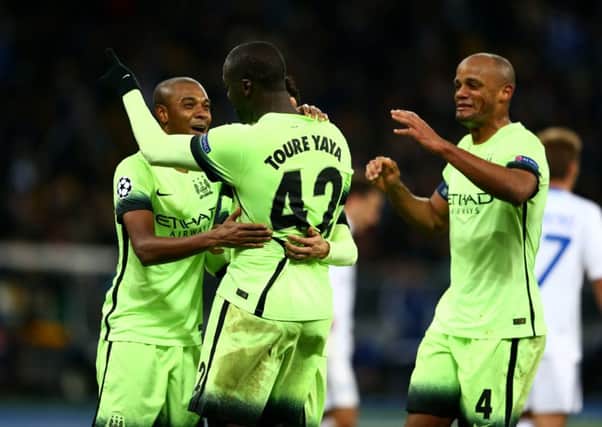 Fernandinho, Yaya Toure and Vincent Kompany celebrate after Manchester City claimed a comfortable 3-1 victory over Dynamo Kiev. Picture: Getty