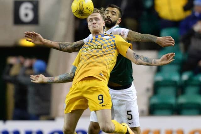 Hibernian's Liam Fontaine (right) challenges Denny Johnstone during Morton's 3-0 win at Easter Road. Picture: Rob Casey/SNS