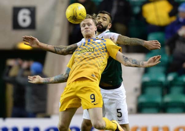 Hibernian's Liam Fontaine (right) challenges Denny Johnstone during Morton's 3-0 win at Easter Road. Picture: Rob Casey/SNS