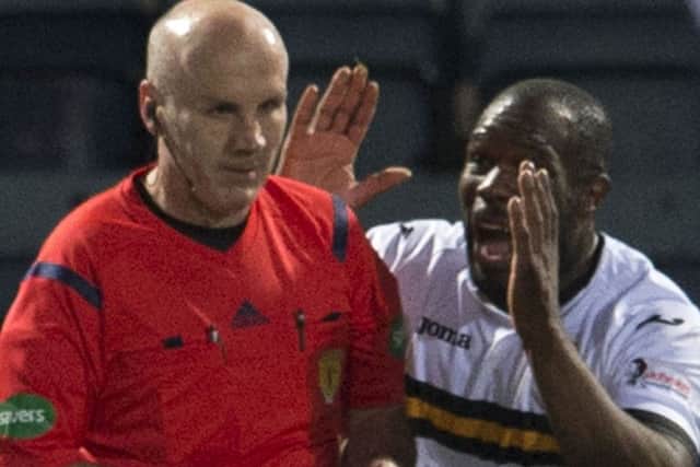Dumbarton's Christian Nade (right) appeals to referee Steven Finnie having gone to ground. Picture: SNS